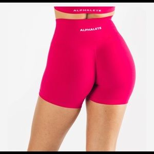 Alphalete amplify shorts (pink)
